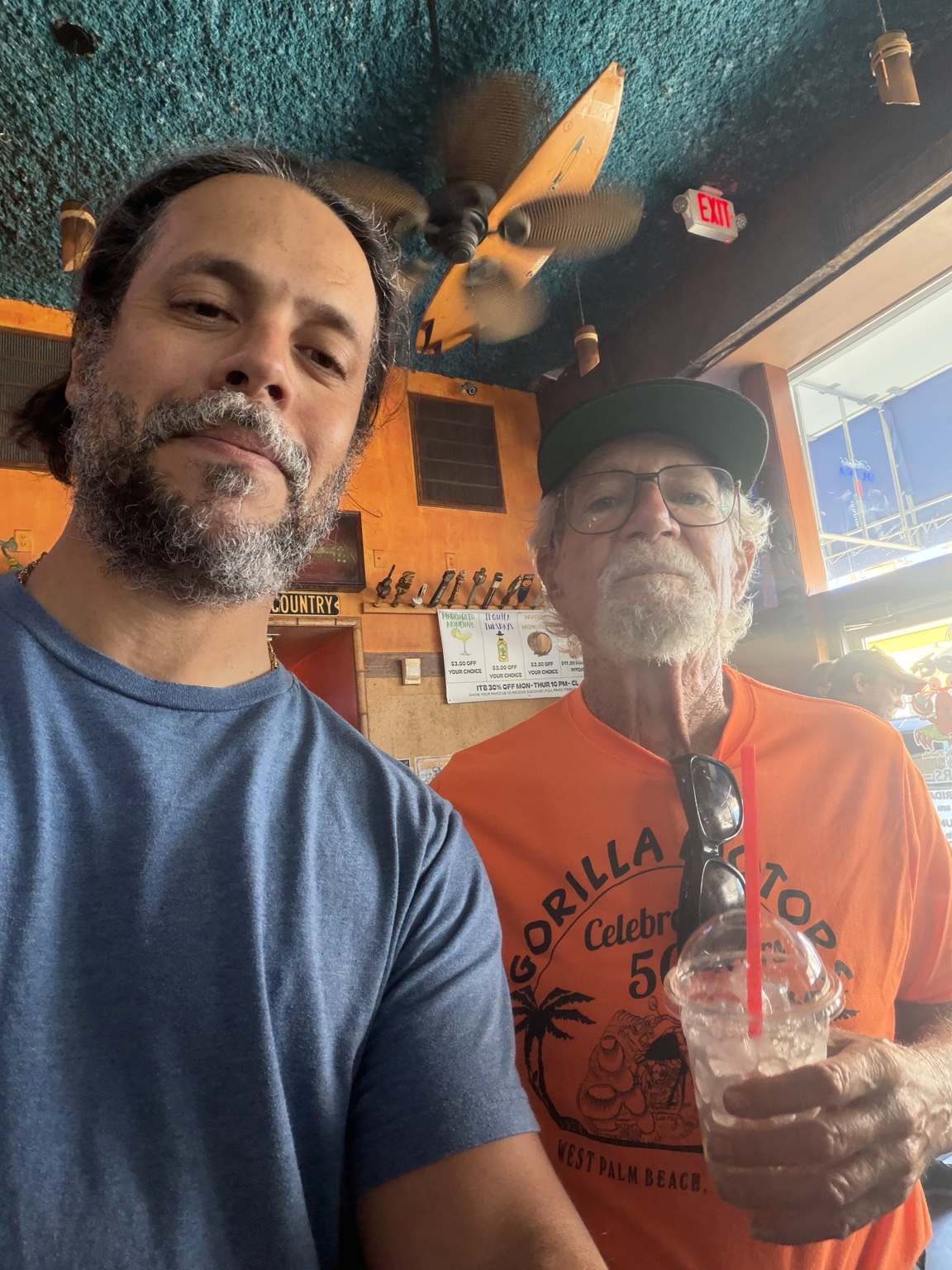 Two people taking a photo together at a local restaurant